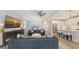 Open-concept living room showcasing modern furnishings, sleek decor, and a seamless flow to the kitchen and dining area at 17744 Savory Mist Cir, Bradenton, FL 34211