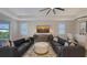 Bright and airy living room with comfortable seating, neutral decor, and a relaxing ambiance at 17744 Savory Mist Cir, Bradenton, FL 34211