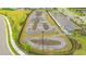 Community pump track for biking and skating enthusiasts, surrounded by lush landscaping at 17744 Savory Mist Cir, Bradenton, FL 34211