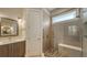 Modern bathroom featuring a tiled shower with a built-in bench and vanity at 1775 Stapleton St, Sarasota, FL 34239