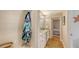 Bright bathroom featuring double vanity, storage, coastal decor, and wood look flooring at 1775 Stapleton St, Sarasota, FL 34239