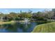 Peaceful community featuring a pond with a fountain at 1775 Stapleton St, Sarasota, FL 34239
