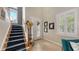 Bright entryway with staircase, tile flooring, and access to the outdoors at 1775 Stapleton St, Sarasota, FL 34239