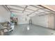 Spacious garage with epoxy floor, shelving, and room for storage at 1775 Stapleton St, Sarasota, FL 34239