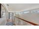 Upstairs hallway with lots of natural light, leading to other rooms of the house at 1775 Stapleton St, Sarasota, FL 34239