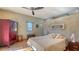 Bedroom with hardwood floors, a ceiling fan, and eclectic decor at 1858 Oak St, Sarasota, FL 34236