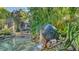 Stunning natural stone waterfall feature in the garden at 1858 Oak St, Sarasota, FL 34236