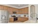 Modern kitchen with stainless steel appliances and white quartz countertops at 20720 Saluti Pl, Venice, FL 34293