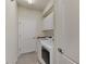 Clean laundry room with washer, dryer, and cabinets at 20720 Saluti Pl, Venice, FL 34293