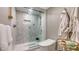 Modern bathroom featuring a glass-enclosed shower with tiled walls and a sleek toilet at 2105 Gulf Of Mexico Dr # 3303, Longboat Key, FL 34228