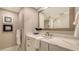Modern bathroom featuring marble countertops and a sleek mirror at 2105 Gulf Of Mexico Dr # 3303, Longboat Key, FL 34228