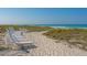 Beach lounge chairs are available on the beach in view of the ocean at 2105 Gulf Of Mexico Dr # 3303, Longboat Key, FL 34228