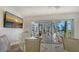 Welcoming common area featuring a TV, sliding glass doors, and neutral decor at 2105 Gulf Of Mexico Dr # 3303, Longboat Key, FL 34228