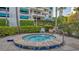 Relaxing hot tub area with manicured landscaping at a condo community at 2105 Gulf Of Mexico Dr # 3303, Longboat Key, FL 34228