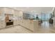 This kitchen offers modern appliances, white cabinetry, a center island, and an open layout at 2105 Gulf Of Mexico Dr # 3303, Longboat Key, FL 34228