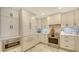 Bright kitchen with white cabinets, stainless steel appliances, marble floors, and lots of storage at 2105 Gulf Of Mexico Dr # 3303, Longboat Key, FL 34228