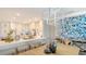 Open kitchen featuring island with seating, granite counters, and stainless steel sink at 2105 Gulf Of Mexico Dr # 3303, Longboat Key, FL 34228
