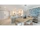 Open floor plan, kitchen island, dining area, and contemporary decor at 2105 Gulf Of Mexico Dr # 3303, Longboat Key, FL 34228