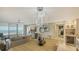 Spacious living room with ocean views, modern lighting, and open floor plan at 2105 Gulf Of Mexico Dr # 3303, Longboat Key, FL 34228
