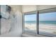 Scenic ocean view from the window overlooking a sandy beach at 2105 Gulf Of Mexico Dr # 3303, Longboat Key, FL 34228