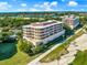 Luxury condo community with lush landscaping and golf course views at 3070 Grand Bay Blvd # 612, Longboat Key, FL 34228