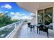 Spacious balcony with outdoor seating, offering stunning water views at 3070 Grand Bay Blvd # 612, Longboat Key, FL 34228