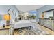 Spacious bedroom with a large bed and access to the balcony at 3070 Grand Bay Blvd # 612, Longboat Key, FL 34228