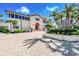 Community clubhouse with inviting entrance and landscaping at 3070 Grand Bay Blvd # 612, Longboat Key, FL 34228