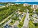 Gated community entrance with lush landscaping and waterfront views at 3070 Grand Bay Blvd # 612, Longboat Key, FL 34228