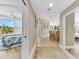 Light and airy entryway leading to dining and bedroom areas at 3070 Grand Bay Blvd # 612, Longboat Key, FL 34228