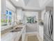 Modern kitchen with stainless steel appliances and granite counters at 3070 Grand Bay Blvd # 612, Longboat Key, FL 34228