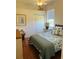 Charming bedroom with a queen-size bed and wood flooring at 3522 Little Country Rd, Parrish, FL 34219