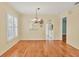 Bright dining area with hardwood floors and a chandelier at 3541 Blechnum Fern Ln, Sarasota, FL 34235