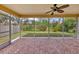 Relaxing screened patio overlooking a beautifully landscaped backyard at 3541 Blechnum Fern Ln, Sarasota, FL 34235