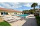 Relaxing pool area with plenty of lounge chairs for sunbathing at 3806 Gulf Of Mexico Dr # C-312, Longboat Key, FL 34228