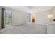 Bright bedroom featuring plush carpeting, neutral walls, and bright, natural light at 4409 Eleuthera Ct, Sarasota, FL 34233
