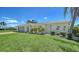 Charming single-story home with mature landscaping and neutral color scheme, with space for two cars at 4409 Eleuthera Ct, Sarasota, FL 34233