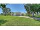 Well-maintained lawn leads to a lovely single-story home with a two-car garage and arched entryway at 4409 Eleuthera Ct, Sarasota, FL 34233