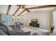 Living room featuring vaulted ceilings with exposed wood beams and an open layout at 4409 Eleuthera Ct, Sarasota, FL 34233