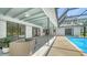 Inviting screened-in pool area with comfortable outdoor seating at 4409 Eleuthera Ct, Sarasota, FL 34233