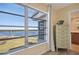 Bedroom with water view from a large window at 4440 Exeter Dr # N304, Longboat Key, FL 34228