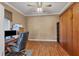 Home office or den with wood floors, desk, chair, and murphy bed at 4518 62Nd E Ter, Bradenton, FL 34203