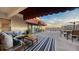 Outdoor space with a view of the ocean, complete with seating and an awning for shade at 4557 Bay Club Dr, Bradenton, FL 34210