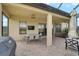 Large covered patio with outdoor furniture, a grill, and a ceiling fan at 4616 Stickley Ct, Palmetto, FL 34221