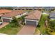 Two-story house with a two-car garage and landscaped yard at 4727 Motta Ct, Bradenton, FL 34211