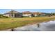 Aerial view of houses with screened lanais located by a canal at 4727 Motta Ct, Bradenton, FL 34211