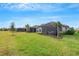 Backyard view showing multiple homes with screened lanais at 4727 Motta Ct, Bradenton, FL 34211