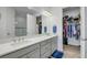 Double vanity bathroom with walk-in shower and large closet at 4727 Motta Ct, Bradenton, FL 34211
