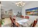 Sunlit dining room adjacent to kitchen, with a table and chairs at 4727 Motta Ct, Bradenton, FL 34211