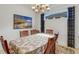 Spacious dining room with a table, chairs, and large artwork at 4727 Motta Ct, Bradenton, FL 34211